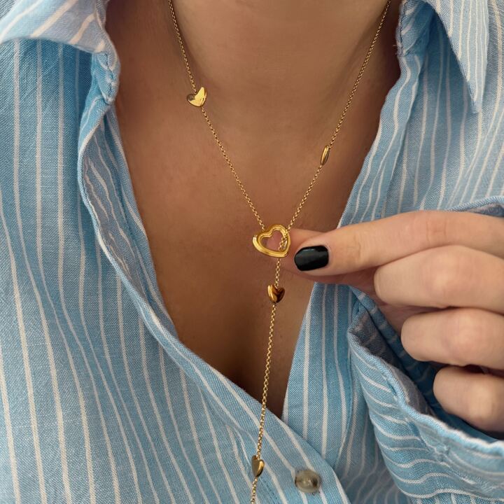 Collier pour femme en acier inoxydable doré forme Y motif coeur ajouré.